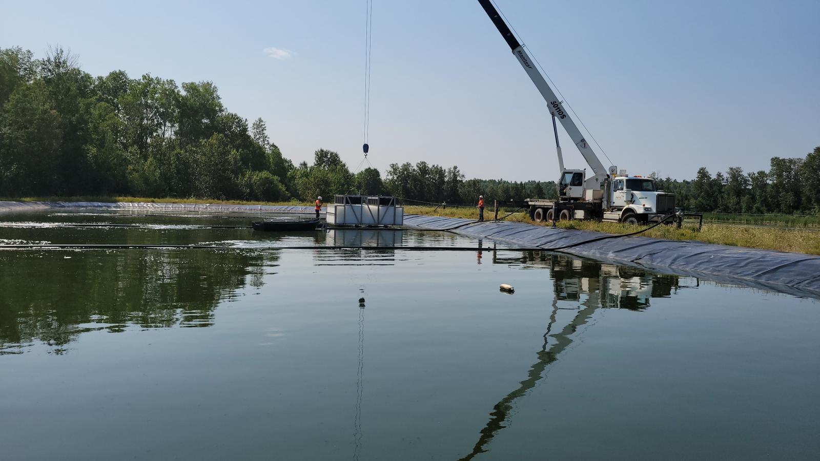 Installation d'un système de traitement des eaux usées Ecofixe dans un étang aéré