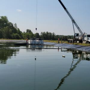 Installation d'un système de traitement des eaux usées Ecofixe dans un étang aéré