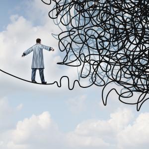 Scientifique sur une corde raide